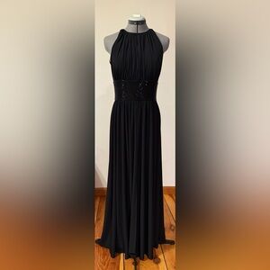 Black maxi dress with high halter neckline, beaded waistband and cut out detail